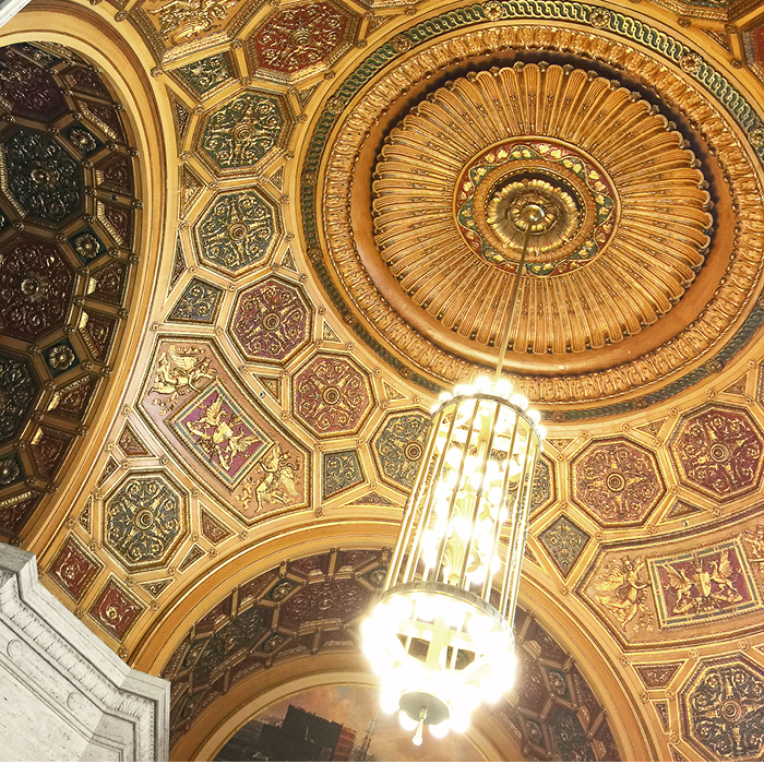 Gilt domed ceiling with tall chandelier