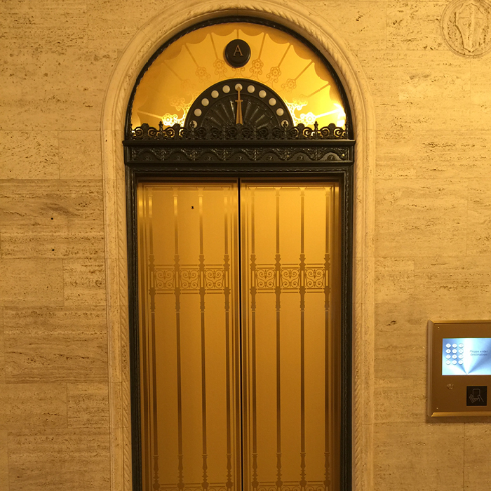 Gilt elevator doors