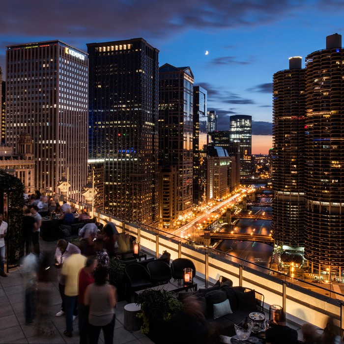 view off an outdoor balcony of cityscape at night