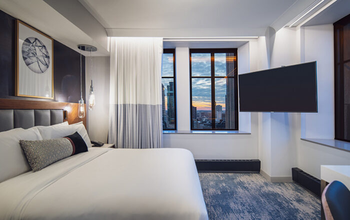 Luxury hotel room with window views of the skyline