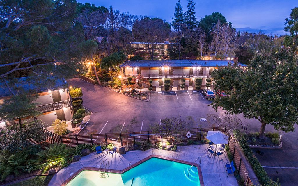 Aerial view of the hotel and outdoor swimming pool at night